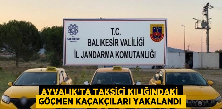 AYVALIK’TA TAKSİCİ KILIĞINDAKİ GÖÇMEN KAÇAKÇILARI YAKALANDI