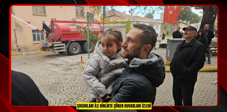 Çocukları ile birlikte çöken duvarları izledi